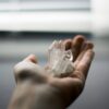 person holding crystal stones