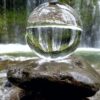 clear glass ball on brown rock